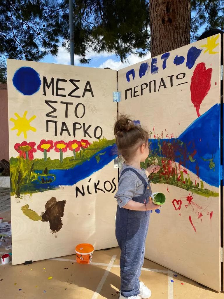 a child painting with his hands